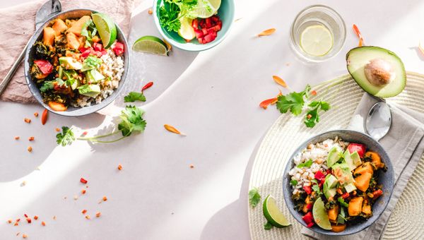 Sliced avocado on cutting board — oleic acid triggers GLP-1 and satiety hormones